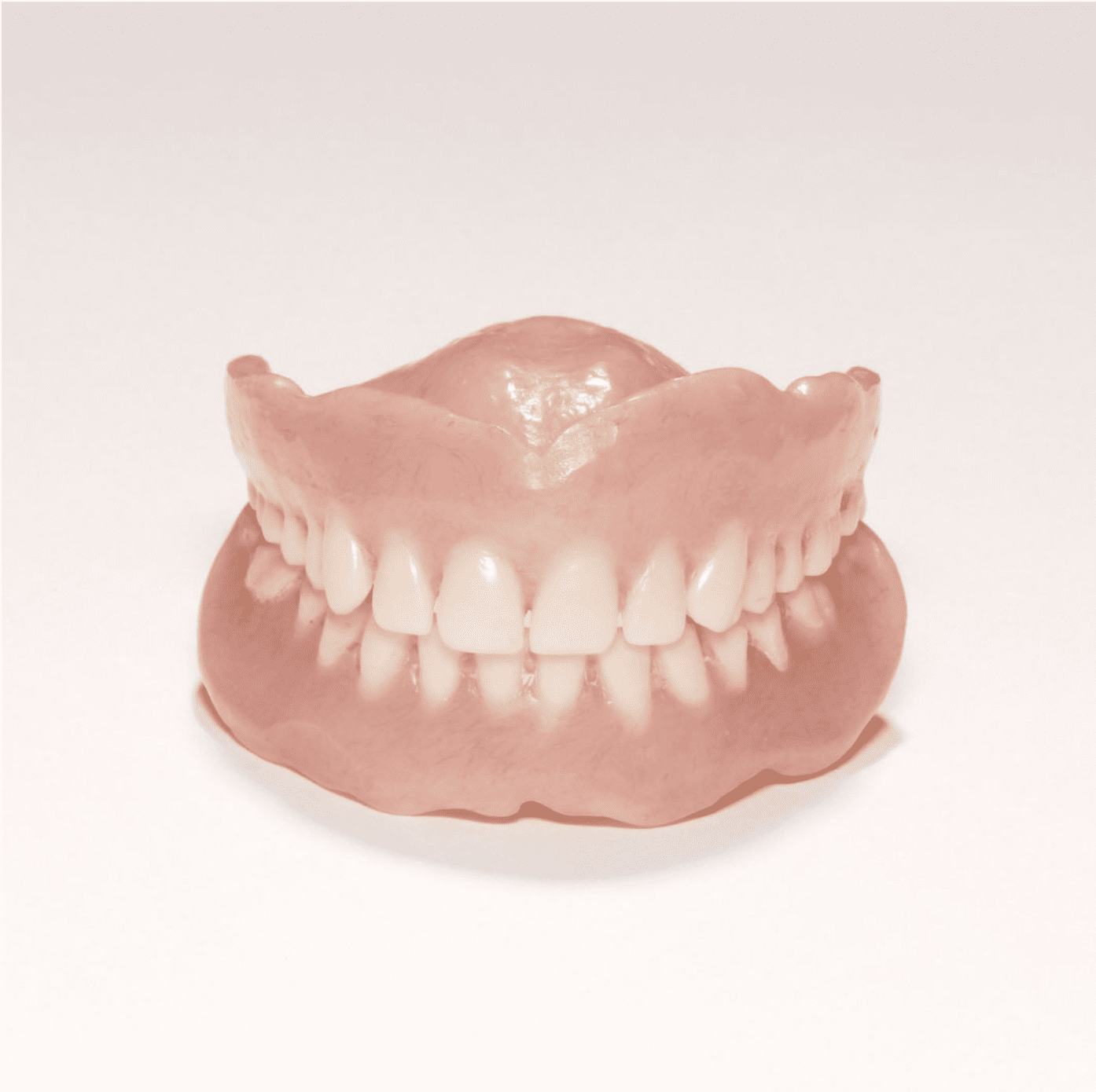 a set of dentures on a white surface